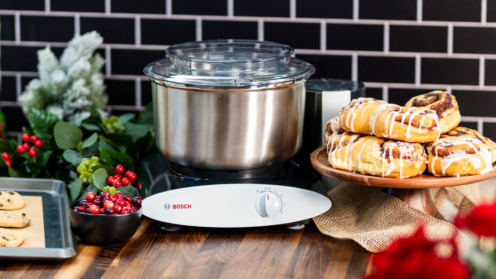 Nutrimill Black Universal Plus Stand Mixer with stainless steel bowl, ideal for mixing, kneading, and whipping.